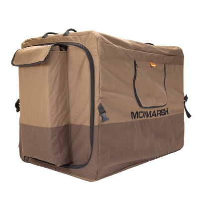 The MOmarsh Inc. MOmarsh Quick Crate is a large, rectangular, brown and tan soft-sided crate with handles, side pocket, and front zippered flap. Sturdy and portable, it's ideal for carrying gear or as a collapsible dog crate.