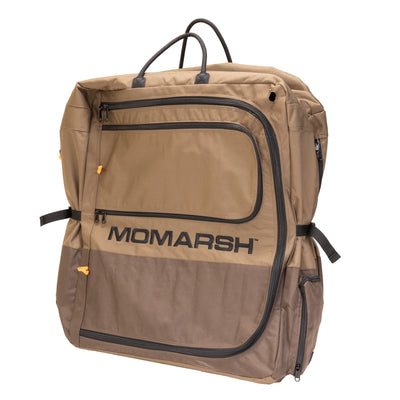 The MOmarsh Inc. Quick Crate is a spacious tan and brown soft-sided travel bag with “MOmarsh” on the front, black zippers, handles, and adjustable straps—ideal as a portable dog crate or for carrying collapsible crates on the go.