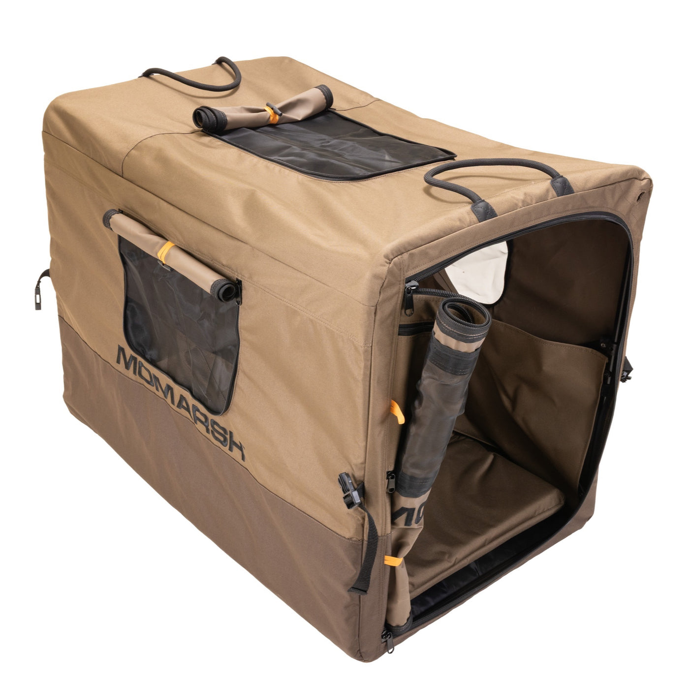 The MOmarsh Quick Crate by MOmarsh Inc. is a tan and brown soft-sided portable dog kennel with mesh windows, zippered front door, side and top handles, storage pockets, and an attached rolled-up mat inside.